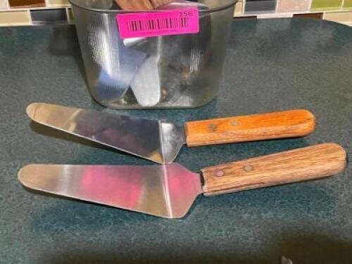 DESCRIPTION: (11) STAINLESS PIE SERVERS W/ WOODEN HANDLES LOCATION: SEATING THIS LOT IS: SOLD BY THE PIECE QTY: 11