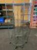 DESCRIPTION: 27" X 27" WIRE CORNER SHELF ON CASTERS - FOUR TIER SIZE: 27" X 27" X 72" LOCATION: 7 QTY: 1 - 2