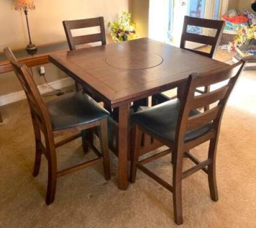 DESCRIPTION: 5PC WOODEN DINING TABLE SET WITH LAZY SUSAN CENTER AT PUB HEIGHT SIZE: 42"X42"X35" LOCATION: HOUSE #2 LOCATION: 6521 WOODLAND DRIVE CEDAR
