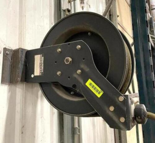 DESCRIPTION: 50 FT. RETRACTABLE HOSE AND WALL MOUNTED REEL BRAND / MODEL: CENTRAL PNEUMATIC LOCATION: WOOD TABLE / TIRE RACK AREA THIS LOT IS: ONE MON