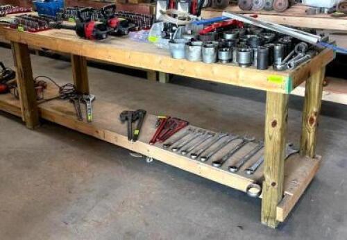 DESCRIPTION: 8' WOODEN WORKBENCH WITH UNDERSHELF INFORMATION: CONTENTS NOT INCLUDED SIZE: 96"X24"X36" QTY: 1