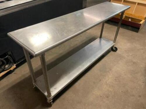 72" X 18" STAINLESS TABLE, ON CASTERS.