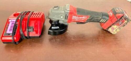 DESCRIPTION: MILWAUKEE 4-1/2" ANGLE GRINDER BRAND/MODEL: MILWAUKEE INFORMATION: BATTERY AND CHARGER INCLUDED LOCATION: SHOWROOM 2 QTY: 1