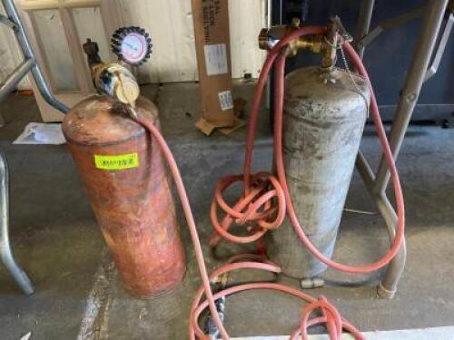 DESCRIPTION: (2) ASSORTED GAS / FUEL CYLINDERS W/ GAUGES AND HOSE. LOCATION: BREEZE WAY THIS LOT IS: ONE MONEY QTY: 1