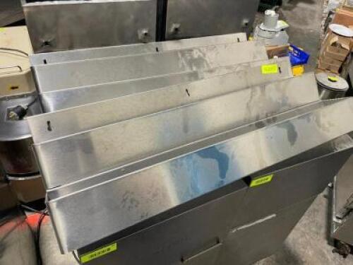 DESCRIPTION: (2) 32" TWO TIER STAINLESS SPEED RAILS ADDITIONAL INFORMATION RETAIL FOR $120 NEW EACH LOCATION: AREA # 2 THIS LOT IS: SOLD BY THE PIECE