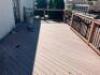 30' X 12.5' COMPOSITE WOOD DECK W/ METAL RAILING POSTS, LIGHTED BANISTERS, AND WIDE STAIRS - 10