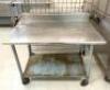 4' STAINLESS STEEL TABLE WITH GALVANIZED UNDERSHELF AND MOUNTED CAN OPENER ON CASTERS