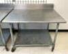 4' STAINLESS STEEL TABLE WITH GALVANIZED UNDERSHELF ON CASTERS