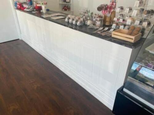 DESCRIPTION: 150" X 26" SALES COUNTER TOP AND CABINET BASE W/ GRANITE SLAB TOP ADDITIONAL INFORMATION SELLER INDICATES COUNTER TOP COST $1500 SIZE 150