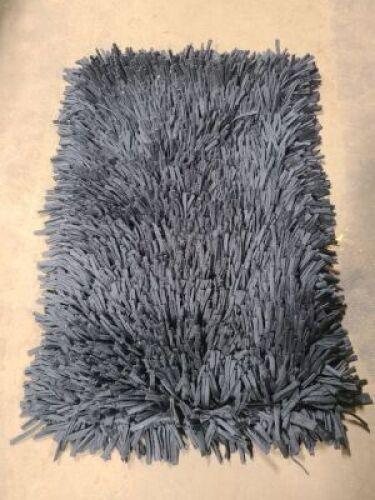 DESCRIPTION: (1) WOVEN SHAG TROW RUG INFORMATION: BLACK RETAIL$: 52.05 SIZE: 2X4 MUST INSPECT QTY: 1