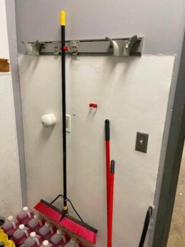 DESCRIPTION: WALL MOUNTED LONG HANDLE TOOL HOLDER W/ASSORTED LONG HANDLE CLEANING TOOLS. LOCATION: KITCHEN THIS LOT IS: ONE MONEY QTY: 1