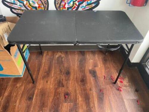 DESCRIPTION: 30" BLACK PLASTIC FOLDING TABLE LOCATION: FRONT QTY: 1