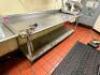 DESCRIPTION: 96" X 30" STAINLESS TABLE W/ 4" BACK SPLASH AND MOUNTED CAN OPENER. SIZE 96" X 30" LOCATION: KITCHEN QTY: 1