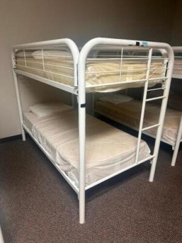 DESCRIPTION: TWIN OVER TWIN WHITE METAL FRAMED BUNK BED WITH MATTRESSES RETAIL PRICE: 233.8 ADDITIONAL INFORMATION: GREAT CONDITION WITH MINOR COSMETI