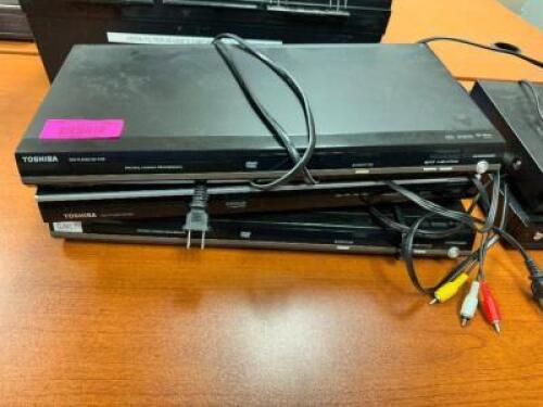 DESCRIPTION: (3) TOSHIBA DVD PLAYERS BRAND / MODEL: TOSHIBA LOCATION: COMPUTER ROOM / BY KITCHEN THIS LOT IS: SOLD BY THE PIECE QTY: 3