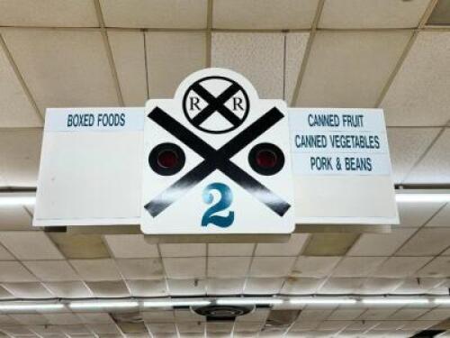 DESCRIPTION: (1) LOT OF ALL THE ISLE SIGNS AND TRAIN CART WOODEN SIGNS. LOCATION: FLOOR THIS LOT IS: ONE MONEY QTY: 1