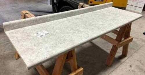 DESCRIPTION: 10' LAMINATE COUNTERTOP IN MATTE PEBBLE PIAZZA WITH INTEGRATED BACKSPLASH BRAND/MODEL: HAMPTON BAY SIZE: 120"X25.25" LOCATION: WAREHOUSE