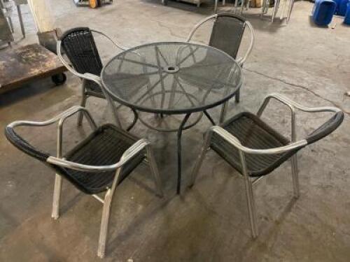 DESCRIPTION 36" ROUND WROUGHT IRON PATIO TABLE AND (4) WICKER AND CHROME PATIO STACK CHAIRS. THIS LOT IS ONE MONEY LOCATION BAY 6 QUANTITY 1
