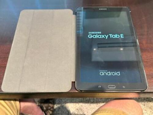DESCRIPTION: SAMSUNG GALAXY TAB E TABLET W/ PROTECTIVE CASE. BRAND / MODEL: SAMSUNG ADDITIONAL INFORMATION NO CHARGING CORD LOCATION: OFFICE QTY: 1