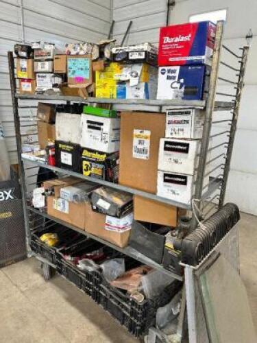 DESCRIPTION: SHELF AND CONTENTS - ASSORTED AUTOMOTIVE AND MOWER PARTS. ADDITIONAL INFORMATION SEE ADDITIONAL PHOTOS LOCATION: BUILDING 6 THIS LOT IS: