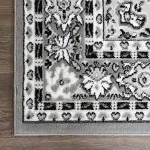DESCRIPTION: (1) AREA RUG BRAND/MODEL: PREMIUM #7069-451 INFORMATION: GRAY, DAMAGE ON TOP CORNER, LISTED IN PHOTOS, MUST COME INSPECT RETAIL$: $157.58