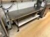 DESCRIPTION: 96" X 30" STAINLESS TABLE W/ MOUNTED CAN OPENER - ON CASTERS SIZE 96" X 30'" LOCATION: KITCHEN QTY: 1 - 2