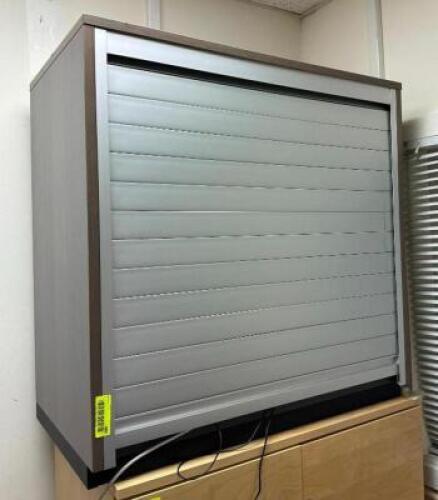 DESCRIPTION: ROLL TOP CABINET INFORMATION: CONTENTS NOT INCLUDED SIZE: 31.5"X18"X31.5" LOCATION: MAIN OFFICE QTY: 1