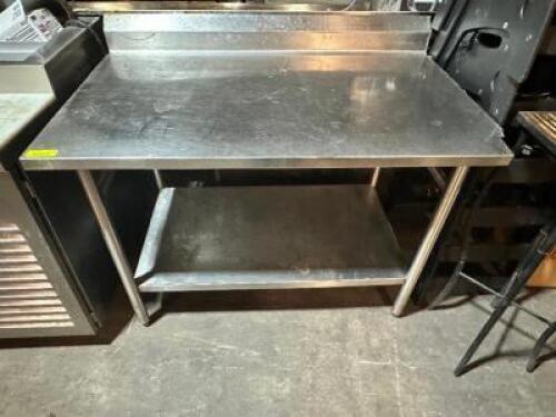 DESCRIPTION: 48" X 30" STAINLESS TABLE W/ 4" BACK SPLASH SIZE 48" X 30" LOCATION: BAY 7 QTY: 1