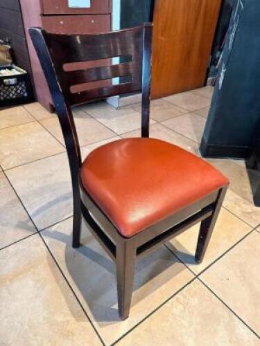 DESCRIPTION: (11) BROWN LADDER BACK WOODEN CHAIRS W/ REDDISH TAN VINYL SEAT CUSHIONS LOCATION: FRONT THIS LOT IS: SOLD BY THE PIECE QTY: 11