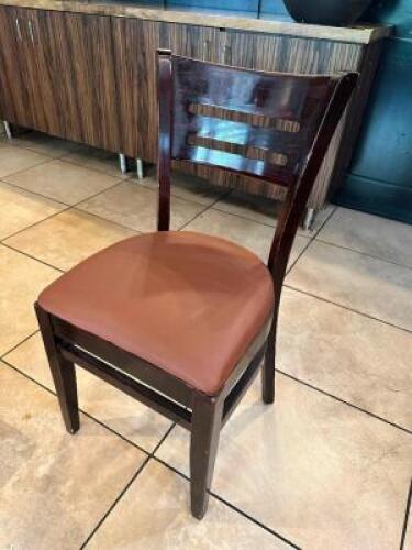 DESCRIPTION: (18) BROWN LADDER BACK WOODEN CHAIRS W/ GREYISH TAN VINYL SEAT CUSHIONS LOCATION: FRONT THIS LOT IS: SOLD BY THE PIECE QTY: 18