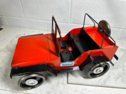 DESCRIPTION: HAND CRAFTED METAL JEEP TRUCK TOY SIZE: 19"X11"X10" QTY: 1