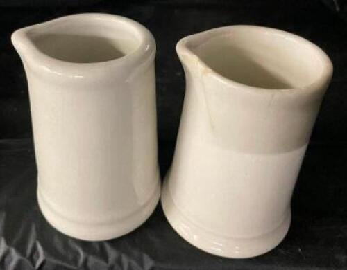 (24) SMALL CERAMIC CREAMER DECANTERS.