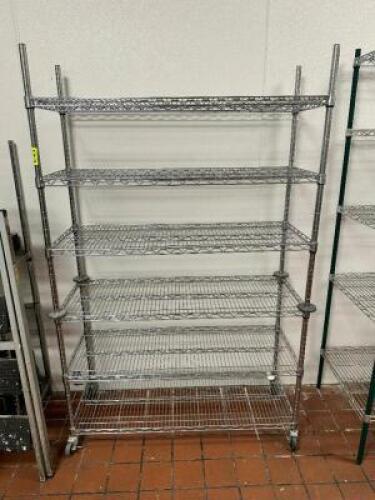 DESCRIPTION: 48" X 24" SIX TIER WIRE SHELF - ON CASTERS SIZE 48" X 24" X 72" LOCATION: KITCHEN QTY: 1