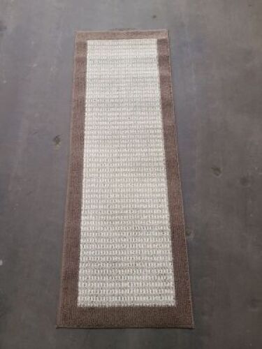 DESCRIPTION: (1) AREA RUG BRAND/MODEL: STYLE SELECTIONS INFORMATION: BROWN SIZE: 53X152 RETAIL$: $32.98 EA QTY: 1
