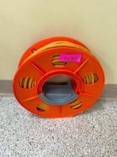 ROLL OF HEAVY DUTY ORANGE EXTENSION CORD.