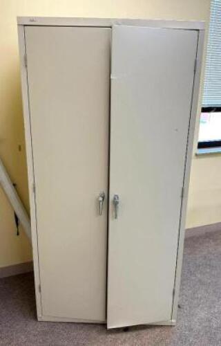2-DOOR METAL STORAGE CABINETLOCATION ACROSS FROM ROOM 212SIZE: 36" X 24" X 72"