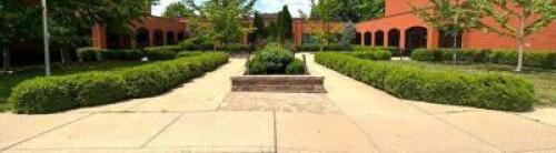 LARGE AMOUNT OF SHRUBS AT FRONT ENTRANCE