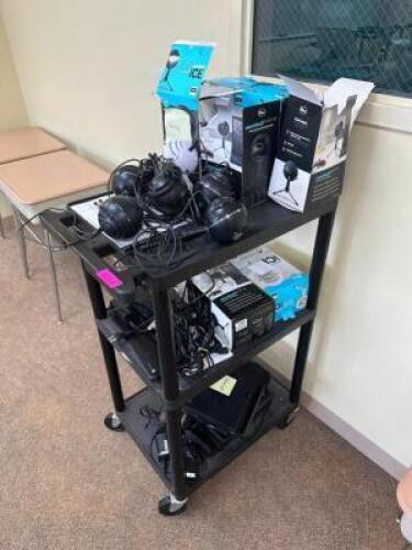 ROLLING CART WITH BROKEN SPEAKERS AND LAPTOPS