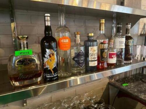 DESCRIPTION: (9) ASSORTED OPEN BOTTLES OF ALCOHOL LOCATION: UPSTAIRS THIS LOT IS: ONE MONEY QTY: 1