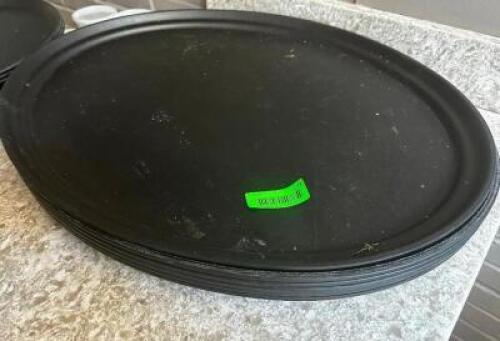DESCRIPTION: (6) 27" OVAL BLACK SERVING TRAYS SIZE 27" LOCATION: BAR / MAIN FLOOR THIS LOT IS: SOLD BY THE PIECE QTY: 6