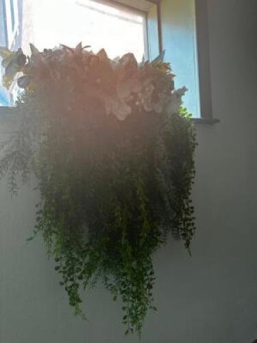 DESCRIPTION: FAUX HANGING WINDOW PLANT W/ CERAMIC CONTAINER. LOCATION: MAIN FLOOR QTY: 1