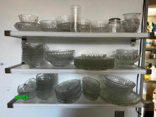 DESCRIPTION: CONTENTS OF SHELF - ASSORTED CRYSTAL BOWLS AND PLATES LOCATION: BAR / MAIN FLOOR THIS LOT IS: ONE MONEY QTY: 1