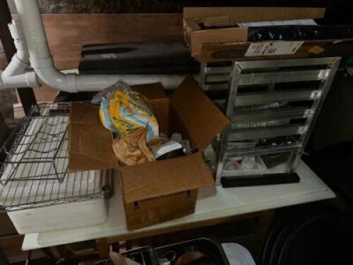 DESCRIPTION: CONTENTS OF TABLE - SMALL TRAY RACK AND ASSORTED SMALL WARES. LOCATION: BASEMENT THIS LOT IS: ONE MONEY QTY: 1