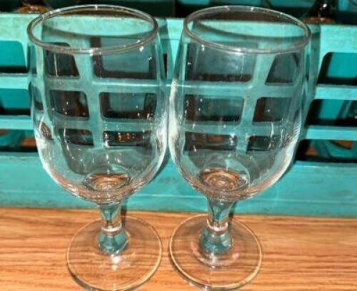 DESCRIPTION: (25) WATER GOBLETS ADDITIONAL INFORMATION W/ GLASS RACKS LOCATION: MAIN SEATING THIS LOT IS: SOLD BY THE PIECE QTY: 25