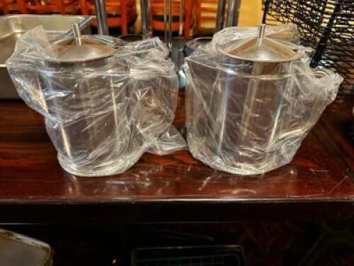 DESCRIPTION: (2) NEW STAINLESS PITCHERS W/ LIDS LOCATION: MAIN SEATING THIS LOT IS: SOLD BY THE PIECE QTY: 2