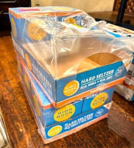 DESCRIPTION: (8) 4 PACKS OF HIGH NOONS INFORMATION: (2) PINEAPPLE FLAVOR, (6) PEACH FLAVOR LOCATION: MAIN DINING QTY: 8