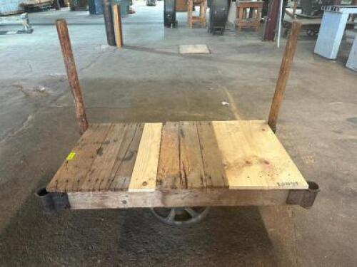 DESCRIPTION: 48" WOODEN WAREHOUSE CART ADDITIONAL INFORMATION W/ HEAVY DUTY CAST IRON WHEELS LOCATION: WAREHOUSE QTY: 1
