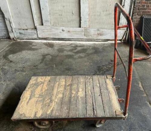 DESCRIPTION: 48" WOODEN WAREHOUSE CART ADDITIONAL INFORMATION W/ HEAVY DUTY CAST IRON WHEELS LOCATION: WAREHOUSE QTY: 1
