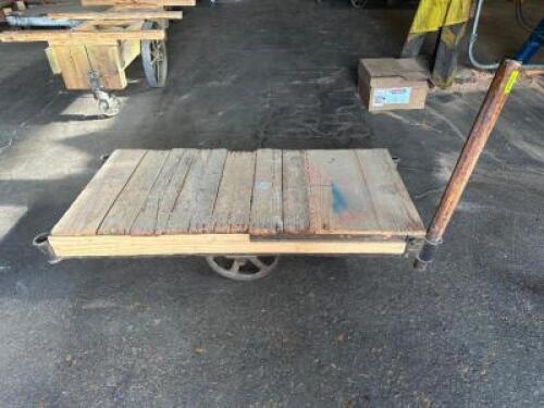 DESCRIPTION: 60" WOODEN WAREHOUSE CART ADDITIONAL INFORMATION W/ HEAVY DUTY CAST IRON WHEELS LOCATION: WAREHOUSE QTY: 1