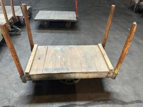 DESCRIPTION: 48" WOODEN WAREHOUSE CART ADDITIONAL INFORMATION W/ HEAVY DUTY CAST IRON WHEELS LOCATION: WAREHOUSE QTY: 1